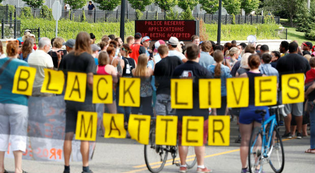 Demonstrators carry a