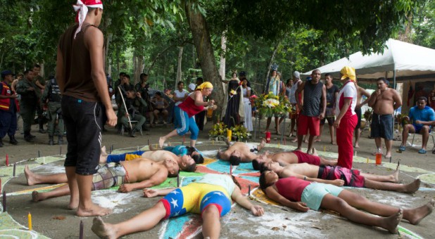 People take part in rituals at the Sorte Mountain on the outskirts of Chivacoa