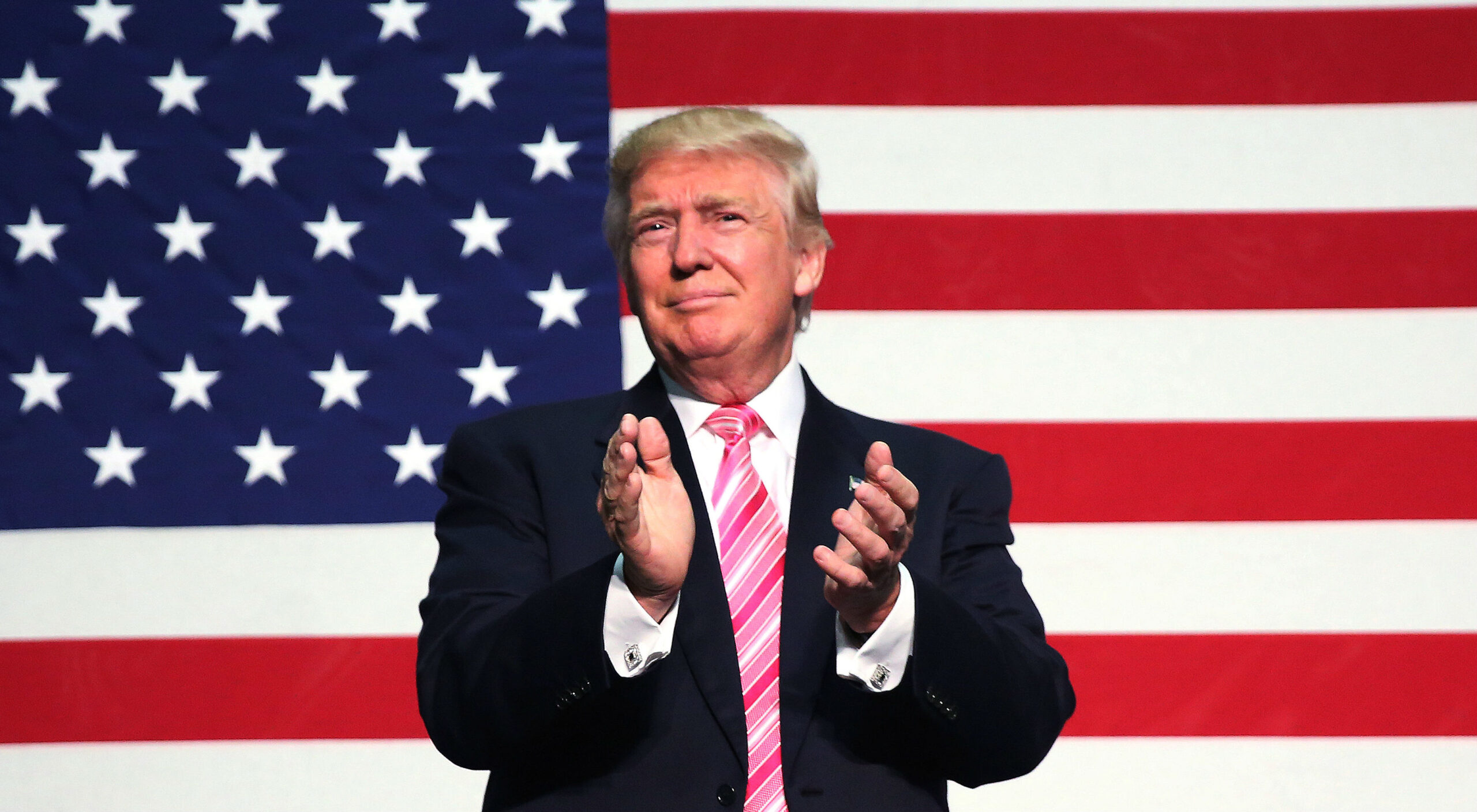 Republican presidential nominee Donald Trump speaks on stage during a campaign rally