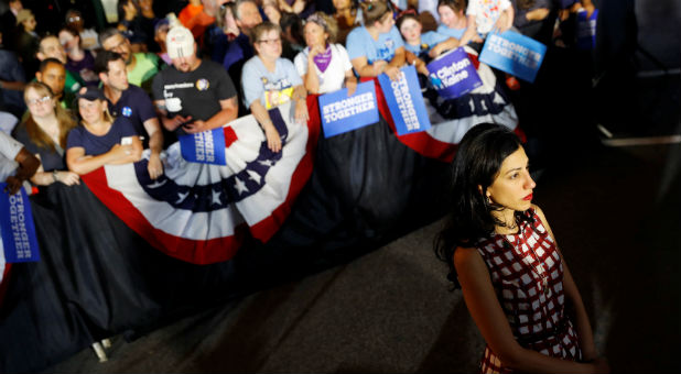 Senior adviser Huma Abedin looks on as Democratic presidential candidate Hillary Clinton campaigns with vice presidential candidate Senator Tim Kaine