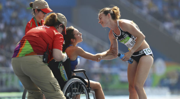 . Nikki Hamblin (NZL) of New Zealand comforts Abbey D'Agostino (USA) of USA.