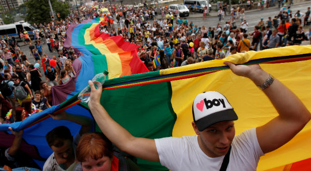 Participants hold a giant rainbow flag during the Prague Pride Parade where thousands marched through the city centre in support of gay rights, in Czech Republic