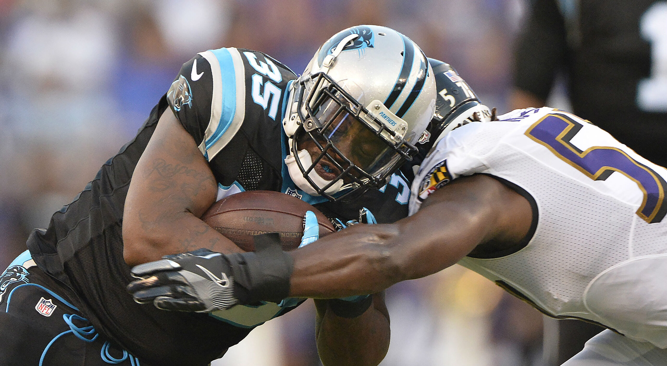 Carolina Panthers fullback Mike Tolbert (35) runs the ball against Baltimore Ravens inside linebacker C.J. Mosley (57) during the first quarter at M&T Bank Stadium.