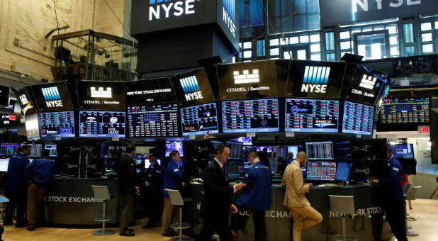 Traders work at the Citadel Securities post on the floor of the New York Stock Exchange.