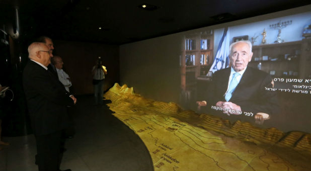 Israeli President Reuven Rivlin – joined by Dr. Evans, Museum Founder, and Gen. Peled, raised by Christians during the Holocaust – watching an introductory video by his predecessor, Shimon Peres, International Chairman of the Friends of Zion Museum.