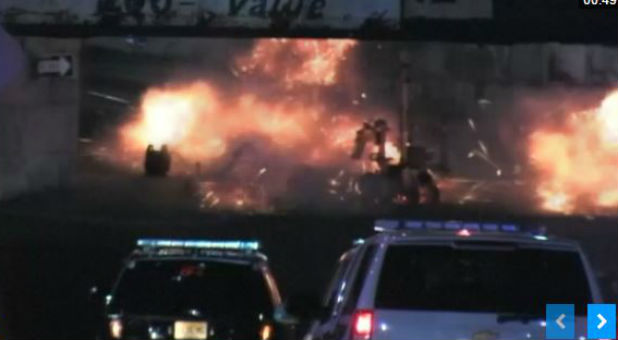 An explosive device detonates as a bomb squad robot attempts to disarm after multiple devices were found in suspicious package near a train station in New Jersey.