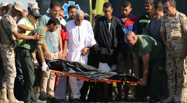 Rescue workers carry the body of a victim on a stretcher after a boat carrying migrants capsized off Egypt's coast, in Al-Beheira, Egypt