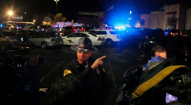 Washington State Trooper Mark Francis speaks to the media at the Cascade Mall following reports of an active shooter in Burlington, Washington.