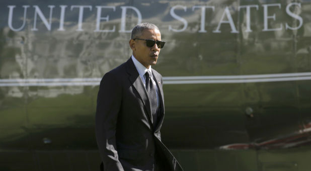 U.S. President Obama walks from Marine One as he returns to the White House in Washington