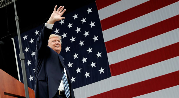 Republican U.S. presidential nominee Donald Trump waves to supporters at a campaign rally in Greensboro