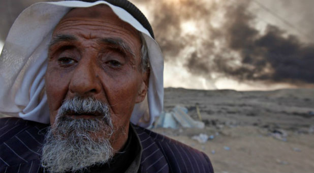 A man returns to his village after it was liberated from Islamic State militants, south of Mosul in Qayyara