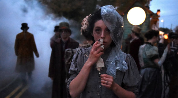 Members of street performance troupe Macnas participate in their 30th anniversary during Halloween parade called Savage Grace in Galway, Ireland