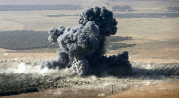 Smoke rises at Islamic State militants' positions in the town of Naweran