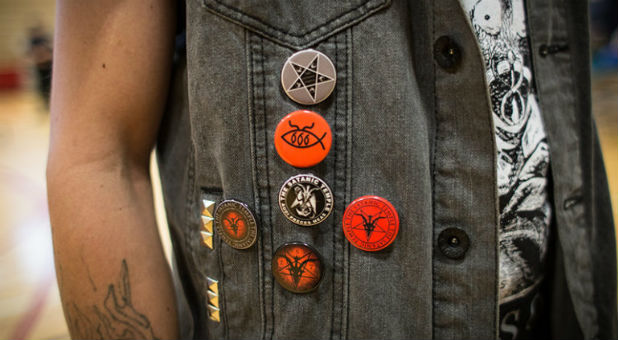 Mike Ryberg, an atheist who identifies with the Satanic Temple's philosophical approach, wears buttons from the the group, on Sept. 30, 2016.