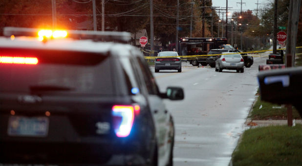 Two Iowa police officers were shot dead on Wednesday while sitting in their patrol cars in what authorities called separate and unprovoked attacks, and a 46-year-old man suspect was captured hours later, police said.