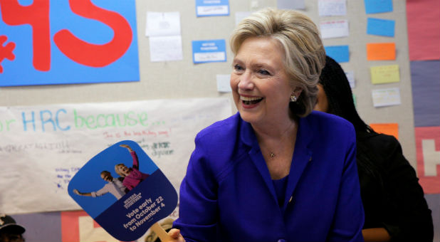 U.S. Democratic presidential nominee Hillary Clinton waves a campaign fan during a visit to a campaign field office in North Las Vegas, Nevada