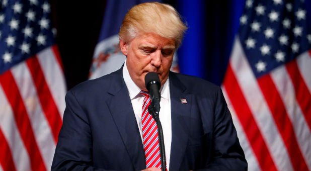 Donald Trump holds a Purple Heart given to him during a campaign event at Briar Woods High School in Ashburn, Virginia