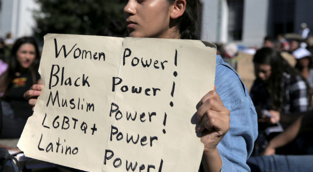 Berkeley High student Ariana Melton holds a sign during a protest in response to the election of Republican Donald Trump as President of the United States in Berkeley, California