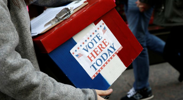 An election volunteer holds a box outside Trump Tower in the Manhattan borough of New York City.