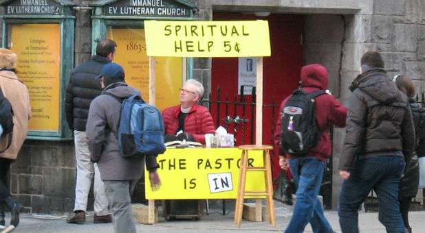 Pastor Greg Fryer sets up his prayer booth.