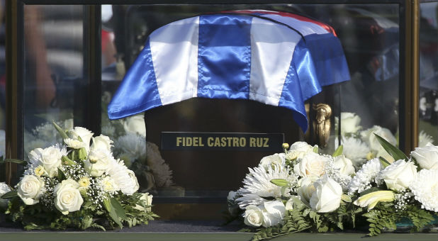 The caravan carrying the ashes of Fidel Castro passes along a street on the way to the eastern city of Santiago in Colon, Cuba