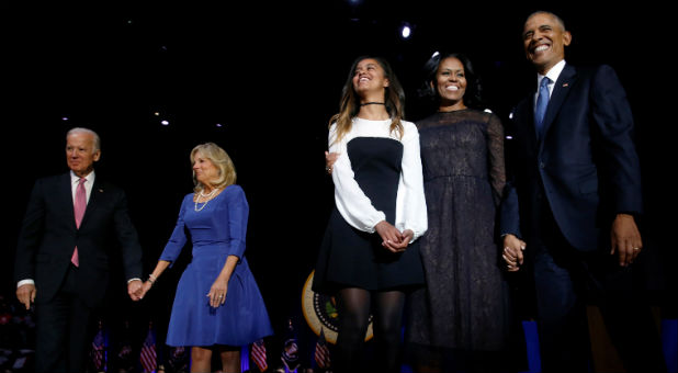 U.S. President Barack Obama (R) is joined onstage by first lady Michelle Obama and daughter Malia, Vice President Joe Biden and his wife Jill Biden, after his farewell address in Chicago.