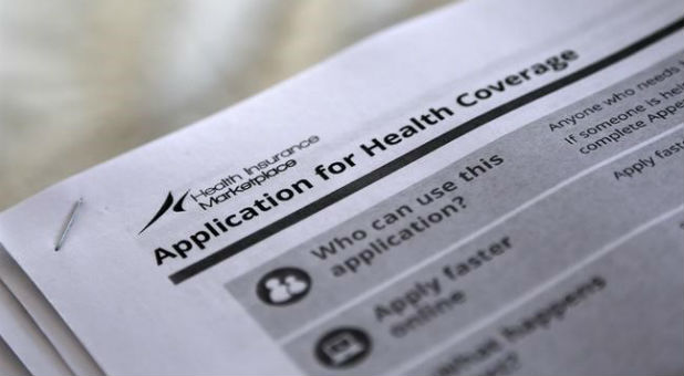 Applications are seen at a rally held by supporters of the Affordable Care Act in Jackson, Mississippi