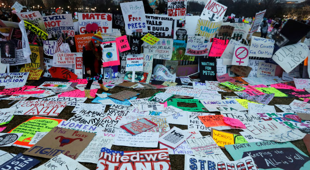 Activists demonstrate against U.S. President-elect Donald Trump outside the Texas State Capitol in Austin, one day ahead of the meetings of the Electoral College