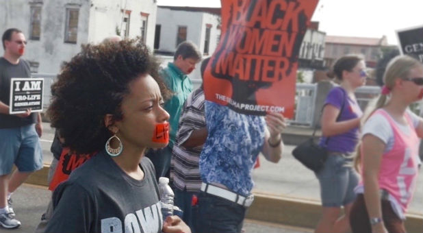 Christina Marie Bennett marches in a Silent Siege.