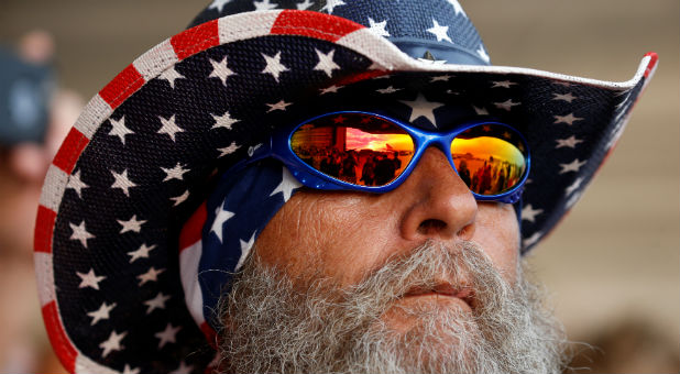 A supporter awaits the arrival of U.S. President Donald Trump for a