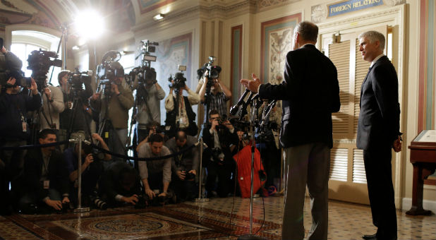 Supreme Court Nominee Judge Neil Gorsuch watches as Chairman of the Senate Judiciary Committee Chuck Grassley (R-IA) speaks to the media on Capitol Hill