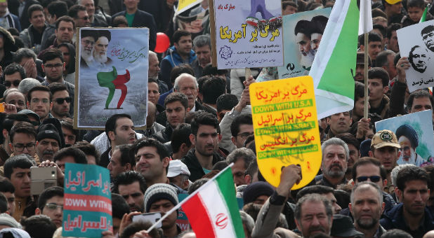 Iranians take part in a ceremony marking the anniversary of Iran's 1979 Islamic Revolution.