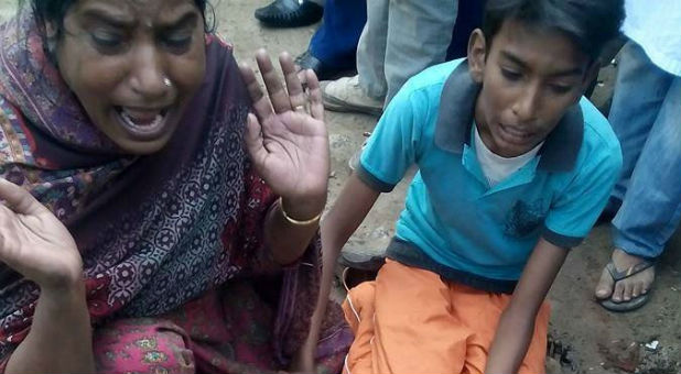 Two people react after the Lahore church bombings.