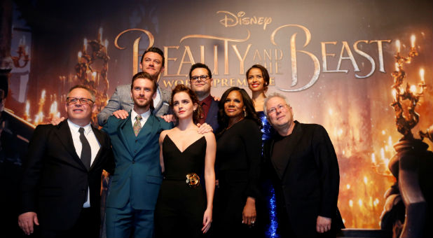 Director of the movie Bill Condon and composer Alan Menken pose with cast members Dan Stevens, Luke Evans, Emma Watson, Josh Gad, Audra McDonald and Gugu Mbatha-Raw