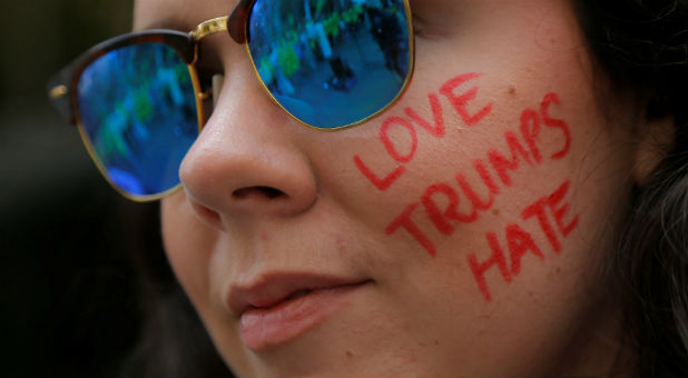 A protester from Amnesty International rallies against U.S. President Donald Trump's new executive order temporarily banning the entry of refugees and travelers from six Muslim-majority countries