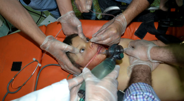 A boy affected by what activists say was a gas attack on the town of Telminnes receives treatment in Bab al-Hawa hospital, where he was transferred, close to the Turkish border, Syria