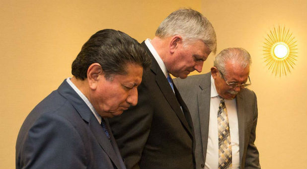 Franklin Graham prays before a