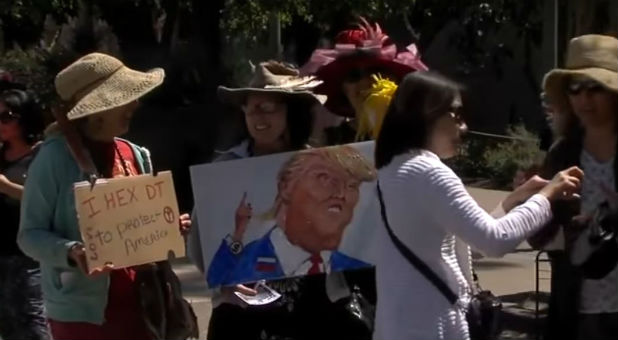 Witches gather to place a hex on Donald Trump.