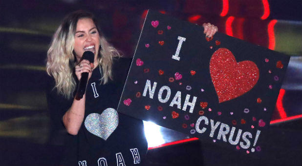 Singer Miley Cyrus speaks on stage during the 2017 iHeartRadio Music Awards