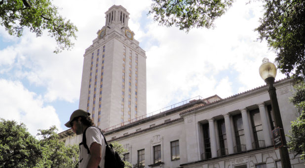 A student walks at the University of Texas campus in Austin, Texas.