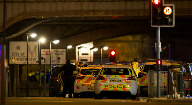 Police officers are seen outside the Manchester Arena.