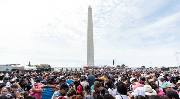 Millennials pray over one another at Together 2016