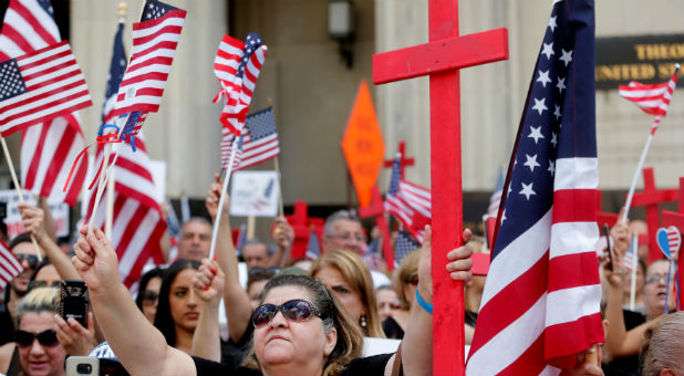 Protesters rally outside the federal court just before a hearing to consider a class-action lawsuit filed on behalf of Iraqi nationals facing deportation, in Detroit, Michigan.