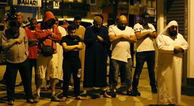 A Muslim boy attends Friday prayers with laborers and shopkeepers.