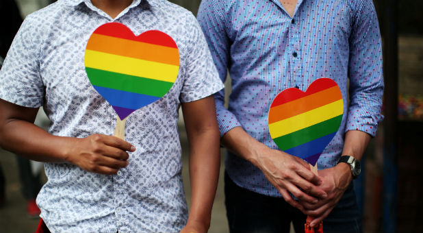 People attend the Gay Pride Parade in San Salvador, El Salvador.