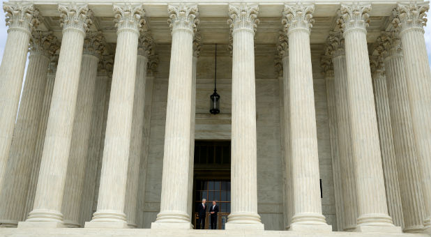 Chief Justice of the United States John Roberts (R) stands with associate Justice Neil Gorsuch during his investiture ceremony at the Supreme Court in Washington.