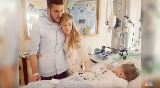 Charlie Gard's parents look at their son.