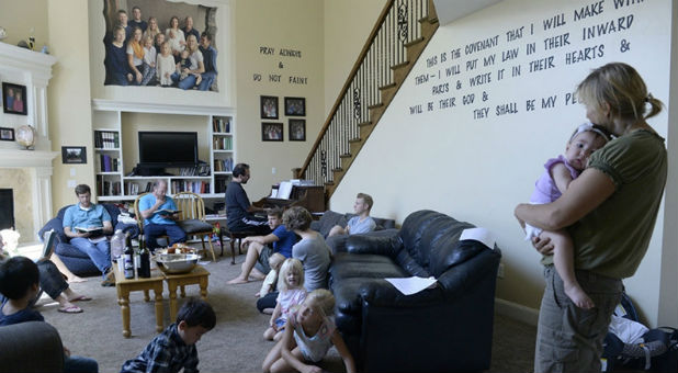 Believers in Denver Snuffer’s Remnant movement gather in a Sandy, Utah, home for a fellowship meeting on Aug. 13, 2017, to sing songs and partake of the sacrament.