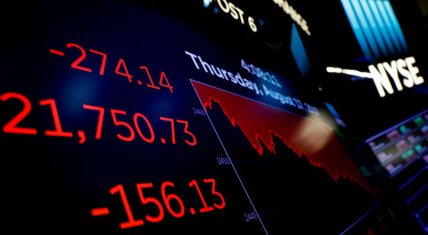 A screen displays the Dow Jones Industrial Average after the closing bell on the floor of the New York Stock Exchange (NYSE) in New York, U.S., August 17, 2017.