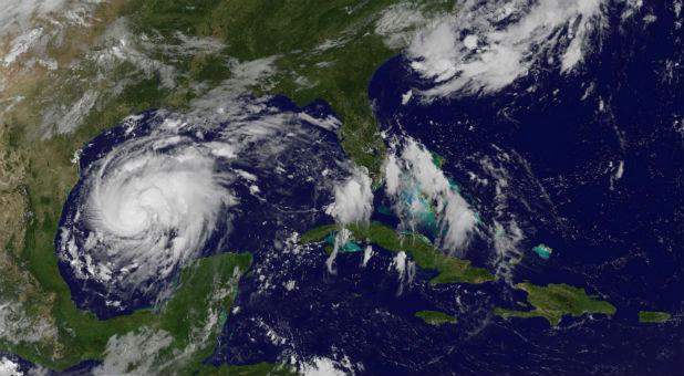 Tropical Storm Harvey is seen approaching the Texas Gulf Coast, U.S., in this NOAA GOES East satellite image taken at 10:07 ET (14:07 GMT) Aug. 24, 2017.